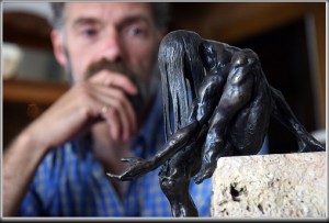 Tim Holmes with his bronze "Who Gives All Gifts"